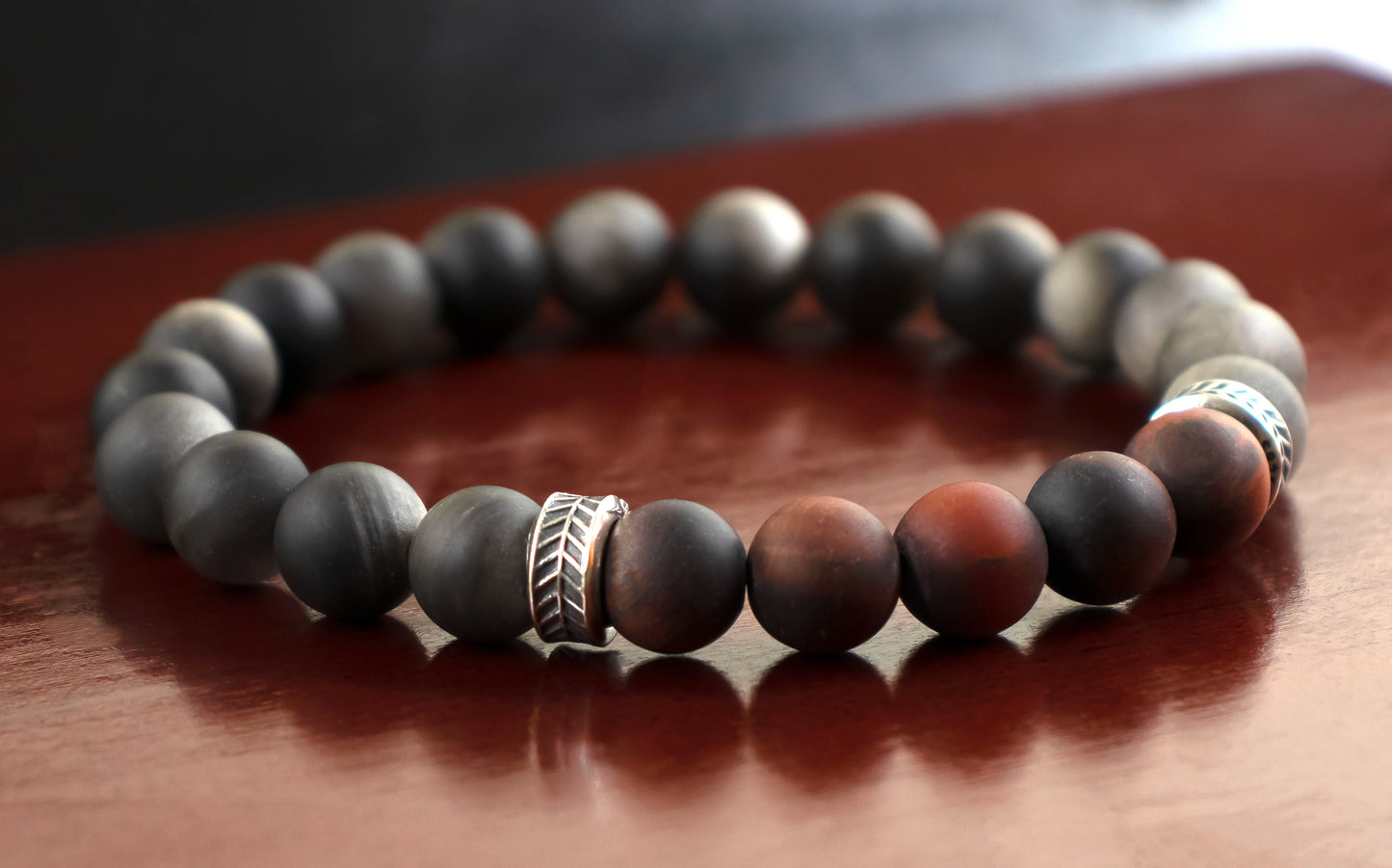 Protection/Strength - A Quality Matte Mahogany Red Tiger’s Eye/ AAA Quality Matte Silver Obsidian/.925 Sterling Silver Accents - 8mm