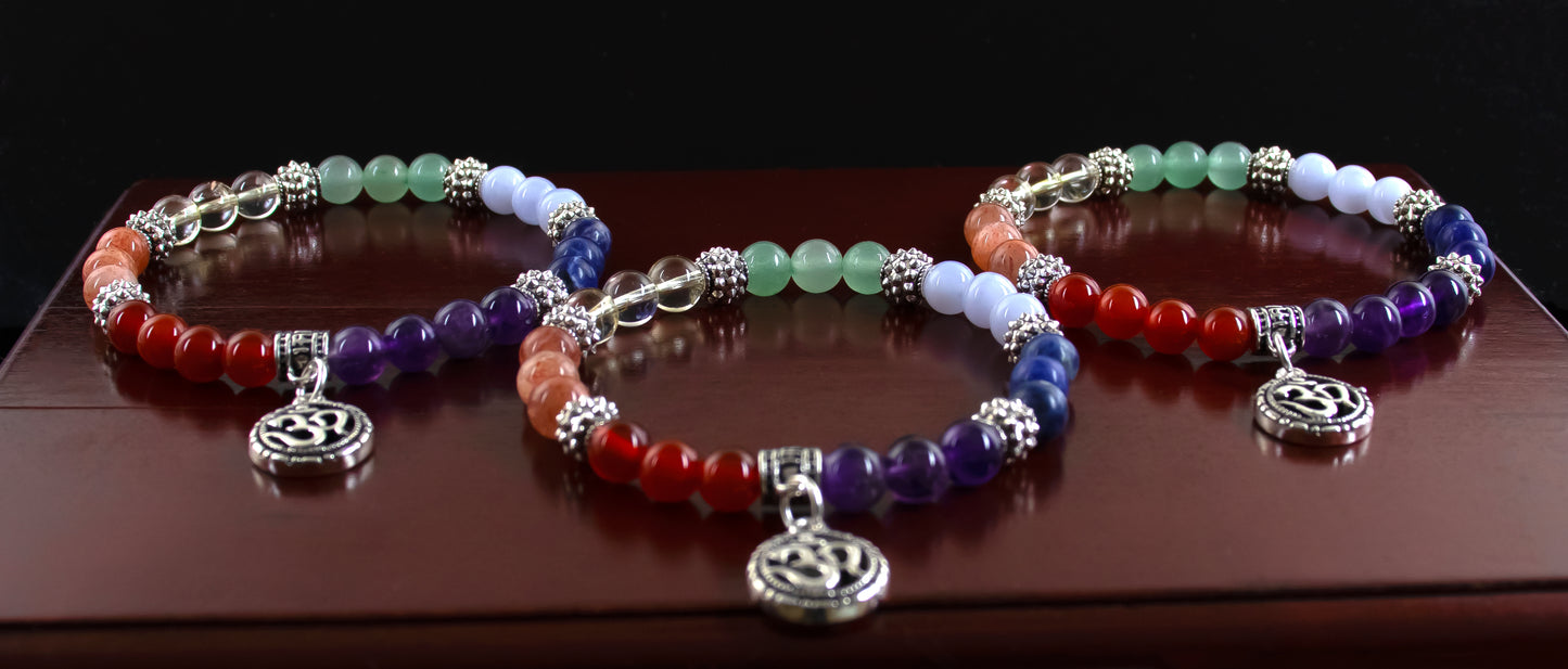 Chakra bracelet/AAA+ Quality Gemstones/.925 Sterling Silver OM charm and Bail with .925 Sterling Silver Accents