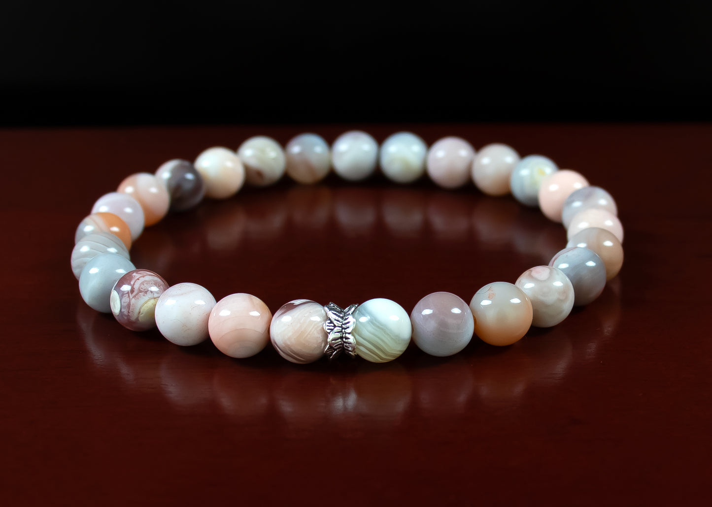 Change/Focus - A+ Quality Pink Botswana Agate Gemstone with a .925 Sterling Silver Accent - 6mm