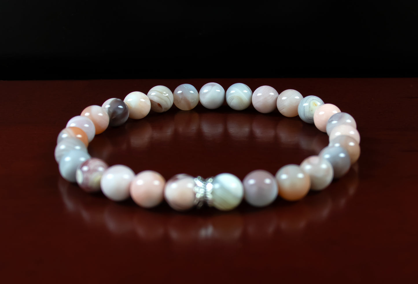 Change/Focus - A+ Quality Pink Botswana Agate Gemstone with a .925 Sterling Silver Accent - 6mm