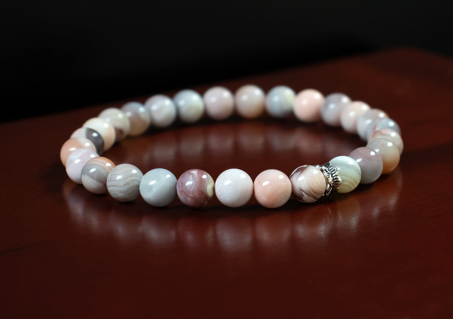 Change/Focus - A+ Quality Pink Botswana Agate Gemstone with a .925 Sterling Silver Accent - 6mm