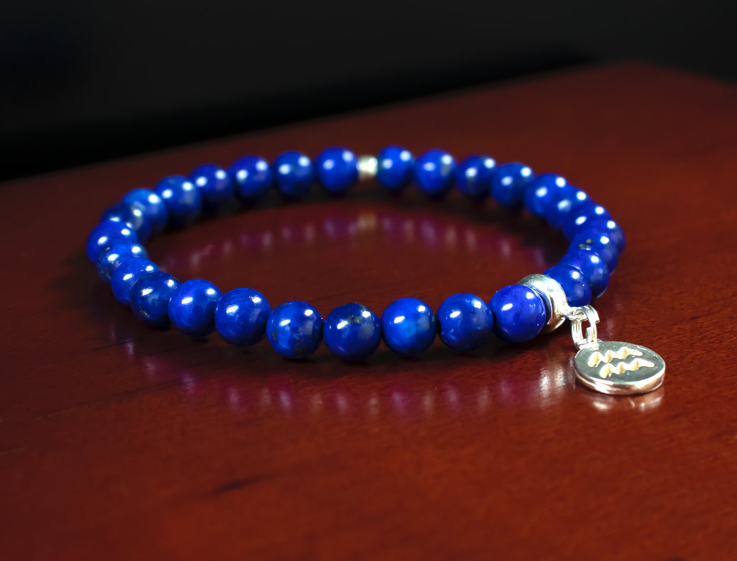 Aquarius - AAA Quality Natural Lapis Lazuli Accented with .925 Sterling Silver Rondelle Beads w/Charm - 6mm